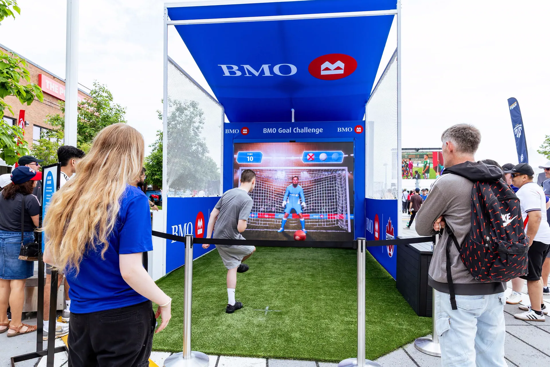 Fan taking a shot at the BMO Goal Challenge LED goalkeeper